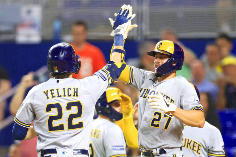 Brewers ride 12-run inning to clinch playoff spot